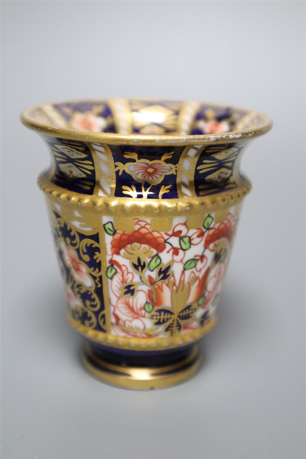 A Royal Crown Derby part tea service, pattern no. 2451, a similar vase and a sugar scuttle (faults)